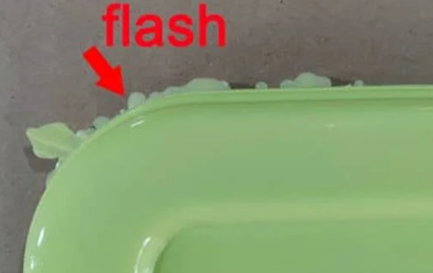 Injection molding flash defect Flash defect along the parting line of injection molded part