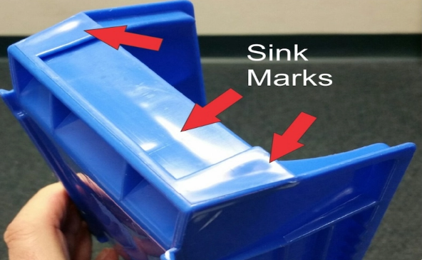 Injection molding sink marks Sink mark defect on thick plastic molded part