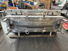 Long curved upper trim injection mold for rear bumper systems