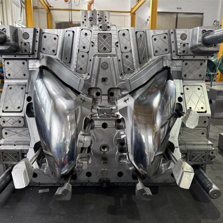 Geometry Constraints Amplify Stress in Automotive Lighting Molds